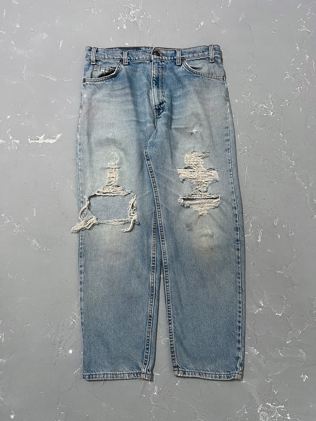 1990s Distressed Levi’s 550 White Tabs [33 x 30]